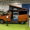 Converted Van showing off the Campervan Services offered at Lomond Campers, including Pop Top Roof Fitting, Fiamma Awning Fitting, Campervan And Motorhome Conversions, Annual Habitation Service, Webasto Diesel Night Heaters and more.