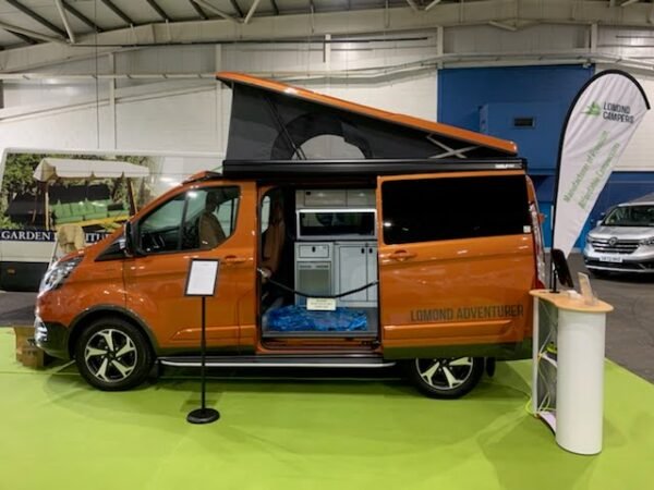 Converted Van showing off the Campervan Services offered at Lomond Campers, including Pop Top Roof Fitting, Fiamma Awning Fitting, Campervan And Motorhome Conversions, Annual Habitation Service, Webasto Diesel Night Heaters and more.